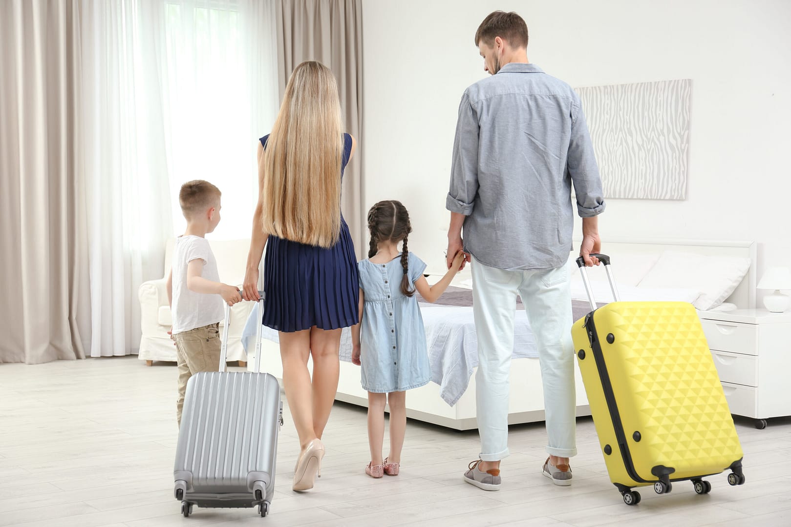 Family,With,Luggage,In,Hotel,Room hotel technology