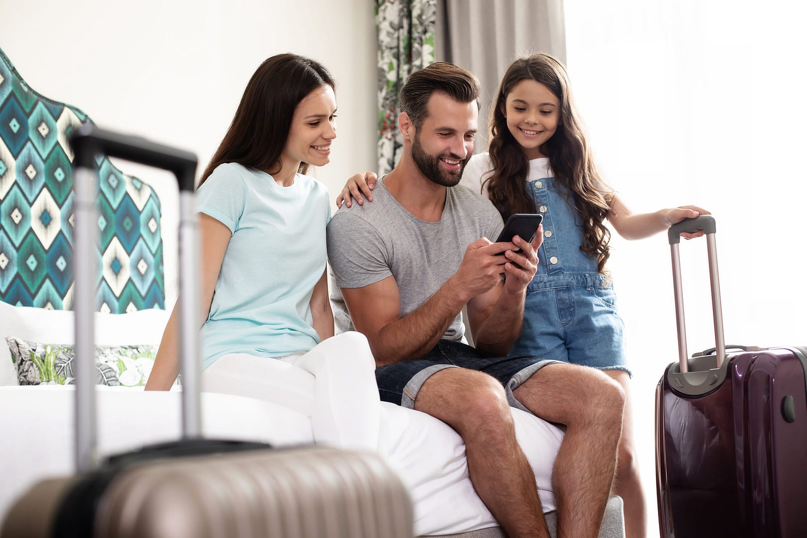 Big,Happy,And,Excited,Tourist,Family,Are,Using,A,Smartphone Hotel technology text messaging 2