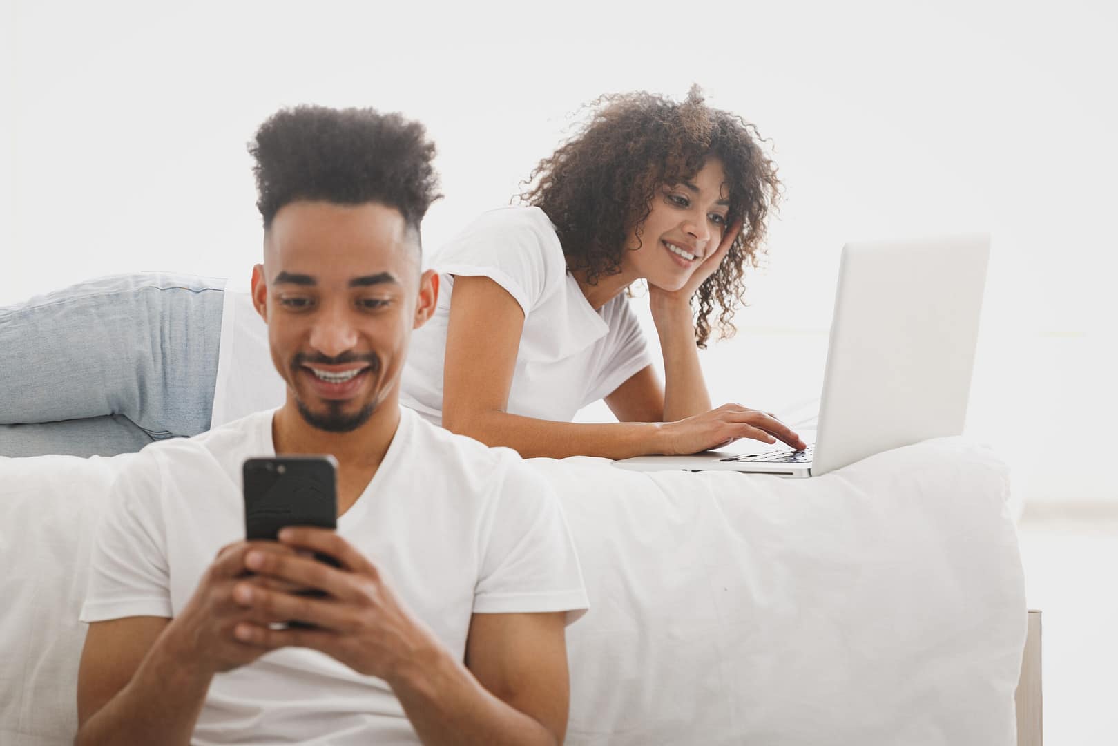 Young,Calm,African,Loving,Couple,Girl,Guy,In,White,T-shirts hotel wifi 1