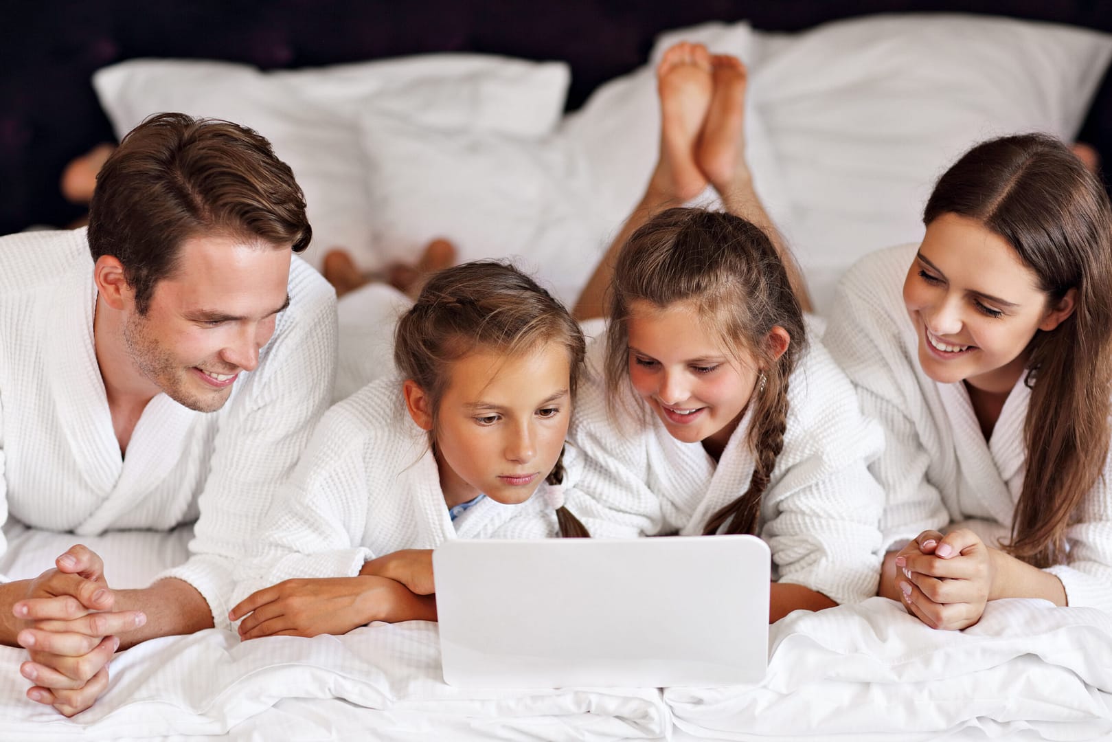 Happy,Family,Relaxing,In,Hotel,Room in-room hotel technology