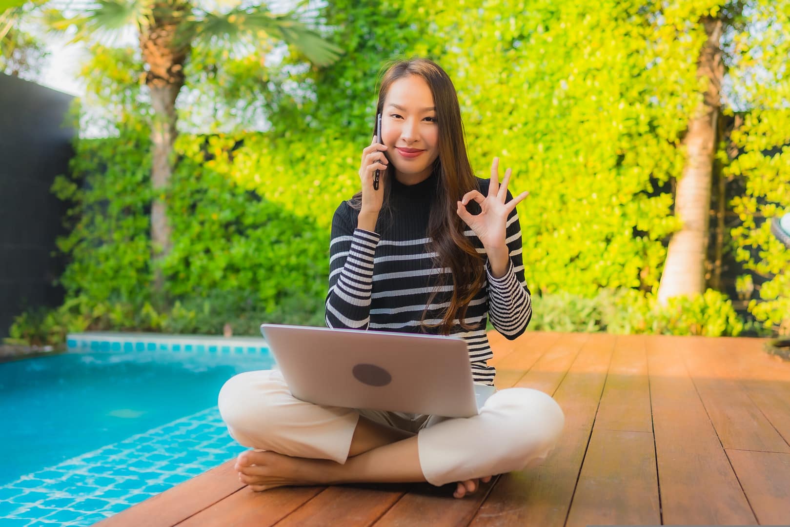 Portrait,Young,Asian,Woman,Using,Laptop,Computer,With,Smart,Mobile hotel wifi 6
