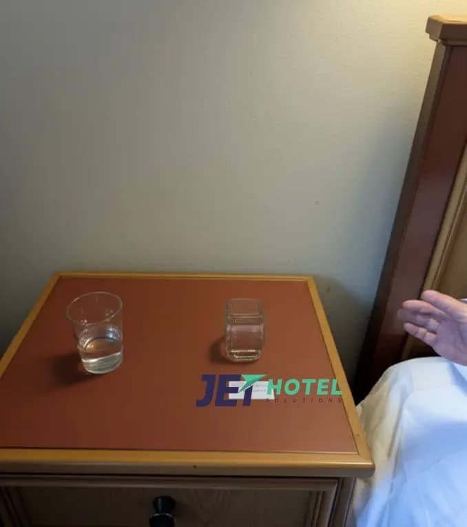 This blurry snapshot could be a senior guest’s last memory of safety—unless your hotel offers a panic button for instant family contact.