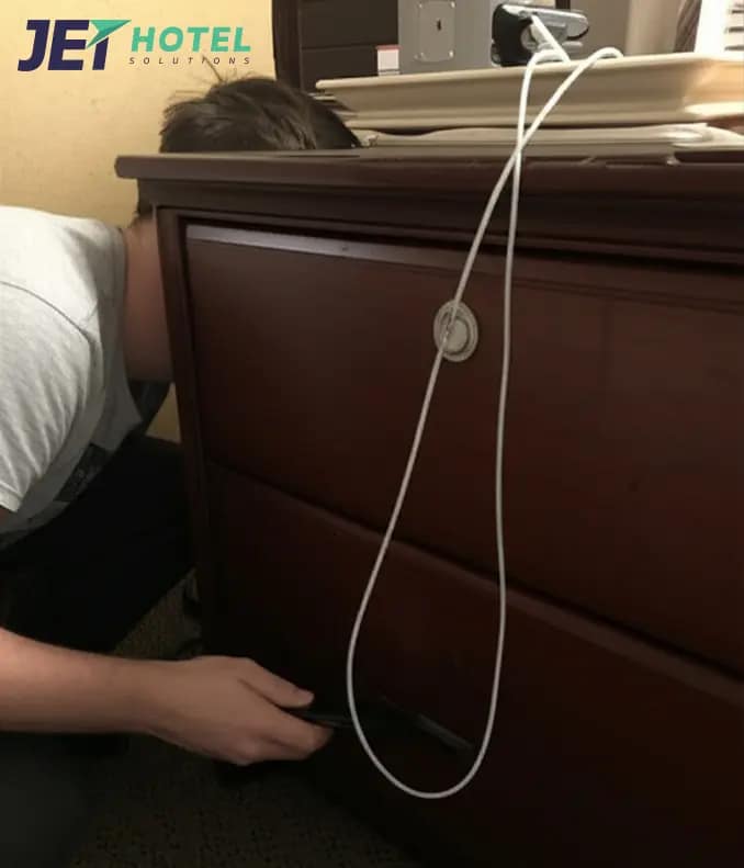 a frustrated guest peering behind the furniture, holding a streaming device